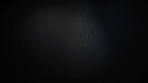帶有微妙漸變和重複圓點圖案的深色紋理背景。 — 簡約暗黑美學 壁紙