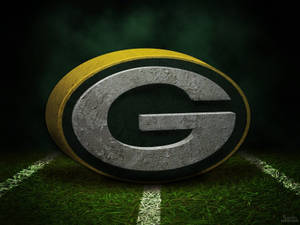 Green Bay Packers 標誌在一個有白色碼線的足球場上。 — 綠灣包裝工 壁紙