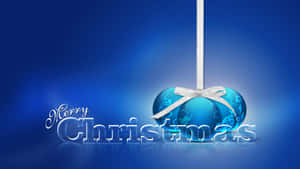 藍色聖誕裝飾，銀色蝴蝶結，「Merry Christmas」文字，藍色漸變背景。 — 聖誕美學 壁紙