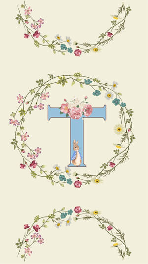 一個帶有花環和兔子插圖的裝飾性字母T。 — 字母 S 壁紙