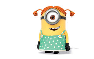 一個黃色Minion，有橙色辮子和綠色圓點裙，正在微笑。 — 可愛女生 壁紙