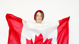 小孩戴紅色毛帽拿著加拿大國旗微笑 — 巴基斯坦國旗 壁紙