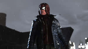Spider-Man 穿著深色外套，站在雪夜的城市中。 — 漫威超級英雄 壁紙