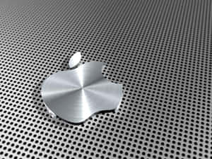 閃亮的 Apple 標誌在穿孔金屬表面上 — 4:3 壁紙