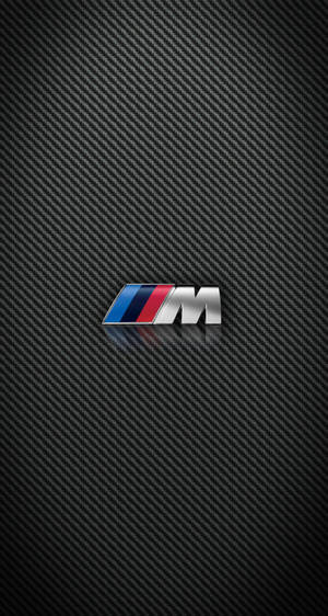 BMW M標誌在碳纖維背景上帶有反射 — Mercedes Benz C300 壁紙