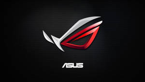 在黑色碳纖維背景上帶有 ASUS 文字的 ROG 遊戲標誌 — 玩家共和國 壁紙