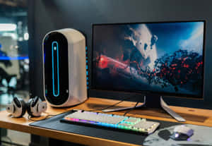 帶有Alienware PC、RGB鍵盤和顯示器上宇宙壁紙的遊戲桌。 — PC 遊戲 壁紙