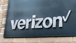 Verizon標誌牌在磚砌建築外牆上。 — 威訊 壁紙