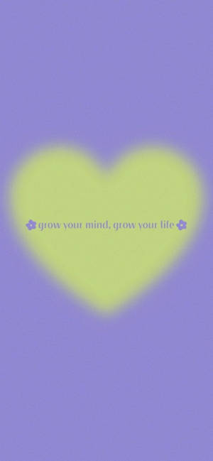 在紫色背景上帶有grow your mind grow your life文字的發光心形 — 美學語錄動圖 壁紙