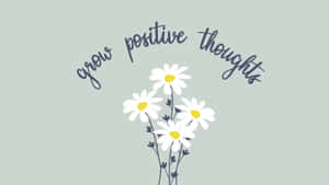 白色雛菊搭配黃色花心，綠色背景上以草書寫著「grow positive thoughts」。 — 正向 壁紙