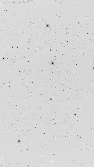 灰色背景上閃爍著星星的夜空。 — 極簡 iPhone 壁紙