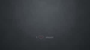 文字在深灰色紋理背景上顯示 I heart music。 — 美學音樂 壁紙