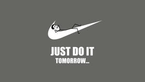 一個男人躺在Nike勾勾內，帶有文字just do it tomorrow。 — 就去做吧 壁紙