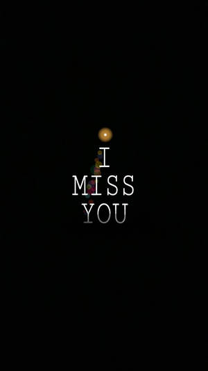 文字為 I MISS YOU，上方有一個發光球體，背景為黑色。 — 想念你 壁紙