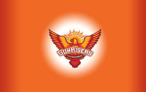 Sunrisers Hyderabad 運動隊標誌，以鳳凰伴隨太陽光線升起為特色。 — 海德拉巴日出者 壁紙