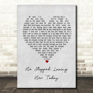 一首名為《He Stopped Loving Her Today》的詩歌印在畫布上，帶有一個紅色心形，靠在磚牆上。 — 鄉村 壁紙