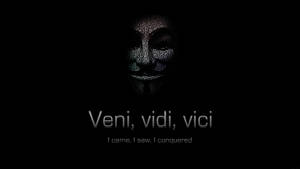 一個帶有拉丁語短語 Veni vidi vici 的發光文字面孔剪影。 — 省電 壁紙