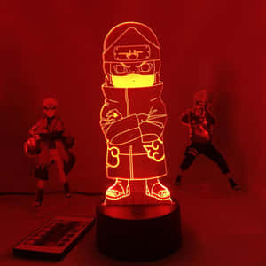 帶有遙控器和公仔的紅色發光3D動漫忍者燈。 — 火影忍者 卡卡西 壁紙