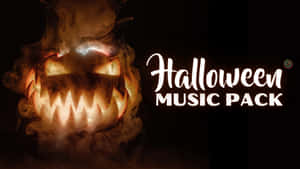 發光的傑克南瓜燈，帶有煙霧和 Halloween Music Pack 文字。 — 可愛萬聖節桌面 壁紙