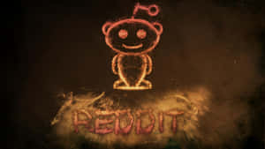 發光的橙色 Reddit 外星人吉祥物，用灰塵繪製，下方有 reddit 字樣。 — Reddit 壁紙