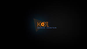 KOI Media Center 標誌，在深色背景上帶有橙色和藍色文字。 — Kodak Black 壁紙
