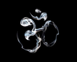發光的白色煙霧在黑色背景上形成「唵」符號。 — 嗡 壁紙
