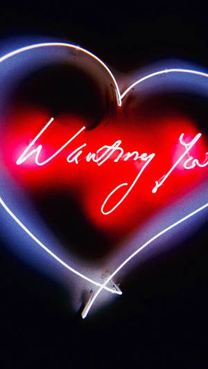 霓虹心形標誌，以紅白燈光顯示「Wanting You」。 — 美學愛情 壁紙