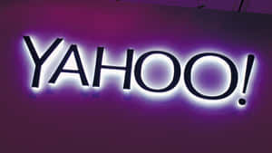 發光的Yahoo標誌招牌，帶有紫色和白色燈光。 — 雅虎 壁紙