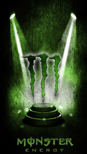 Monster Energy標誌在黑暗有紋理的舞台上被聚光燈照亮。 — Monster Energy 壁紙