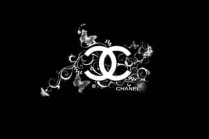 黑色背景上帶有蝴蝶和漩渦的Chanel標誌 — 香奈兒標誌 壁紙