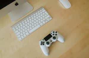 白色遊戲手把放在木桌上，旁邊有鍵盤和iMac。 — MacBook Pro 16 壁紙