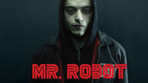 穿著深色連帽衫的男人，身後牆上有紅色「Mr Robot」文字。 — 機器人 壁紙