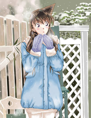 穿著藍色冬季外套和紫色手套的動漫女孩對飄落的雪花感到驚訝。 — 名偵探柯南 壁紙