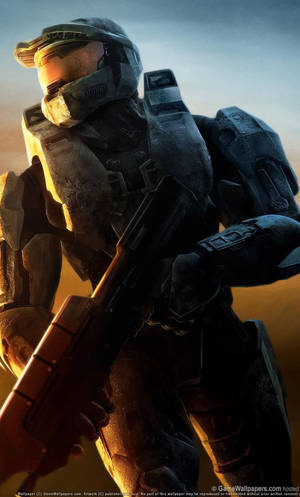 Halo Spartan穿著戰鬥裝備，在日落時分手持步槍。 — 電玩遊戲 GIF 壁紙