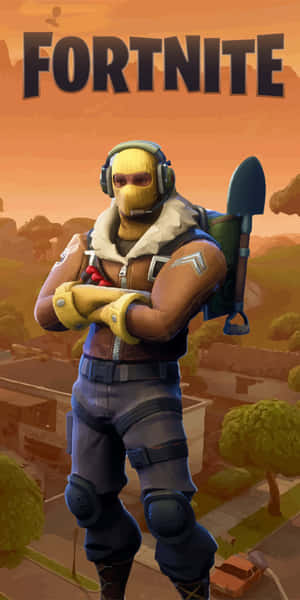 穿著黃色面具和裝備的Fortnite角色自信地交叉雙臂站立。 — 電玩遊戲 GIF 壁紙