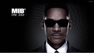 穿著黑色西裝和太陽眼鏡的男人，在數位網格背景上，帶有MIB3 IN 3D文字。 — 黑執事 壁紙