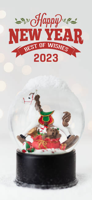 馴鹿和泰迪熊雪球，用於2023年新年祝福。 — Pixel 8a 壁紙
