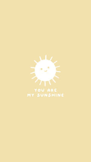 微笑太陽圖示，帶有文字 you are my sunshine，背景為黃色。 — 低對比 壁紙