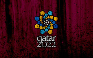 卡達2022世界盃標誌在栗色紋理背景上，帶有藍色和黃色六邊形。 — FIFA 世界盃 壁紙