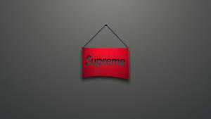 紅色Supreme標誌招牌掛在灰色牆上。 — 紅色至尊 壁紙