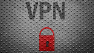 紅色掛鎖圖示在VPN文字下方，紋理灰色金屬背景。 — 設計 壁紙