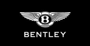 黑色背景上帶翅膀和字母B的賓利標誌。 — 好看汽車 壁紙