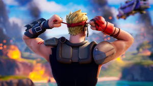 Fortnite角色在戰鬥中調整紅色頭帶，背景有爆炸 — 電玩遊戲 GIF 壁紙