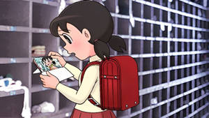 動漫少女穿著校服在更衣室裡拿著漫畫書。 — 庫洛魔法使 壁紙