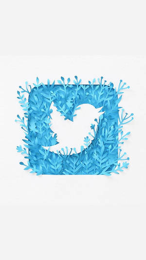 藍色紙雕Twitter鳥標誌，以層疊樹葉框住。 — 推特 壁紙