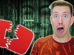 男人對破損的YouTube標誌和系統故障訊息作出震驚反應。 — 間諜忍者 壁紙