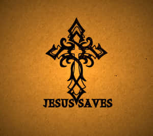 一個裝飾性的黑色十字架，在帶有紋理的棕色背景上帶有文字 Jesus Saves。 — 耶穌被釘十字架 壁紙