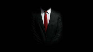 黑色背景前，一個穿著西裝和紅色領帶的男人的剪影。 — 電玩遊戲 GIF 壁紙