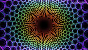 充滿活力的彩虹色幾何圖案，帶有催眠般的同心圓。 — 幻覺 壁紙