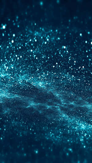 藍綠色宇宙星雲，發光粒子在深空中旋轉。 — 昏暗 壁紙